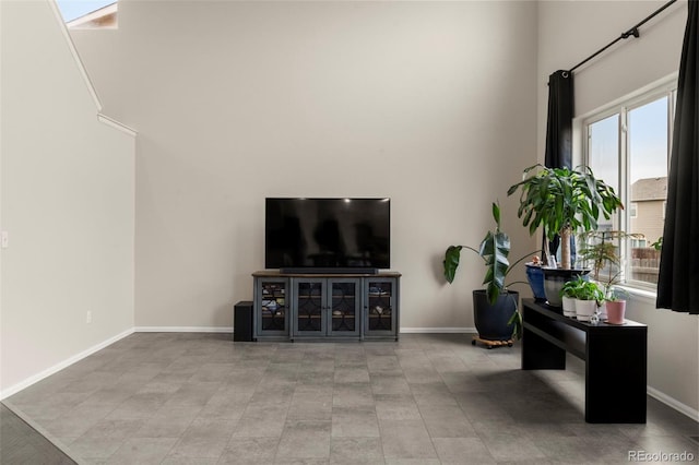 4626 Dancing Rain Way, Colorado Springs, CO 80911 - living room with a towering ceiling, plenty of natural light, and tile patterned floors