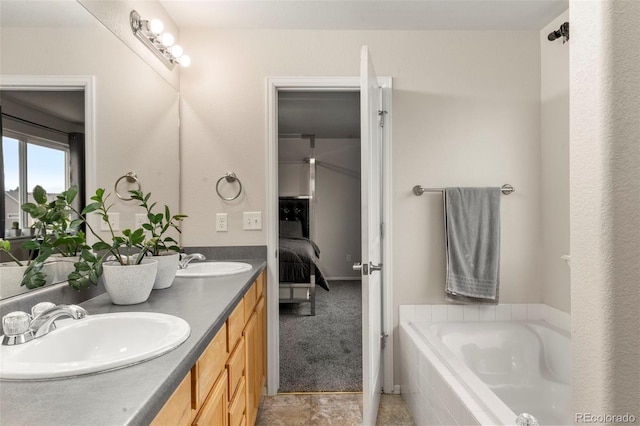 4626 Dancing Rain Way, Colorado Springs, CO 80911 - full bath with double vanity, a bath, and ensuite bathroom