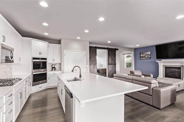 6990 E 132nd Pl, Thornton, CO 80602 - kitchen featuring stainless steel appliances, open floor plan, recessed lighting, light countertops, and tasteful backsplash