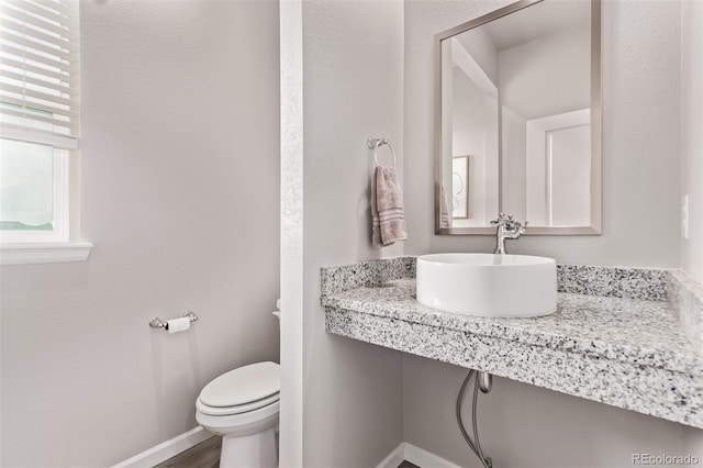 6990 E 132nd Pl, Thornton, CO 80602 - half bathroom with a sink and wood finished floors