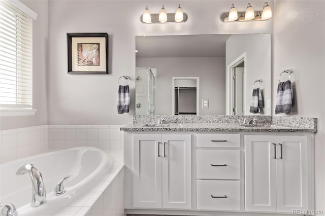6990 E 132nd Pl, Thornton, CO 80602 - full bathroom featuring double vanity, a stall shower, and a garden tub