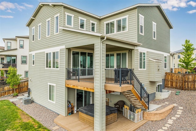 6990 E 132nd Pl, Thornton, CO 80602 - rear view of house featuring a jacuzzi and a deck