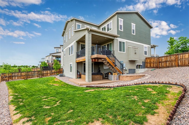 6990 E 132nd Pl, Thornton, CO 80602 - back of property featuring stairs, a fenced backyard, a patio, and a wooden deck