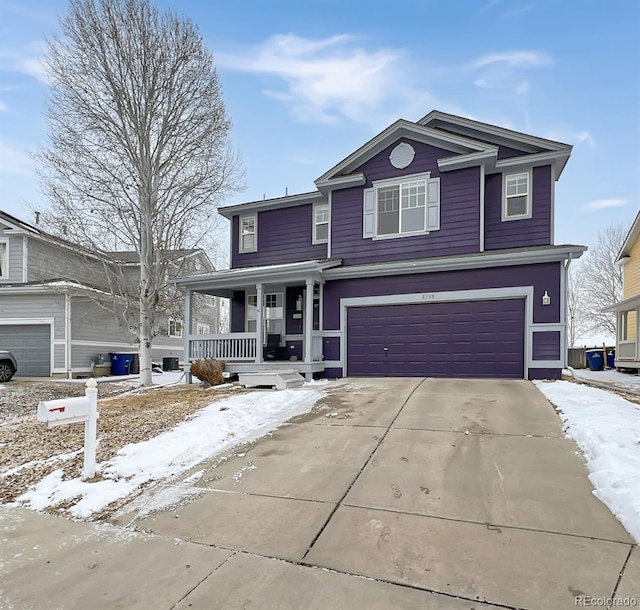 view of property featuring a garage and a porch