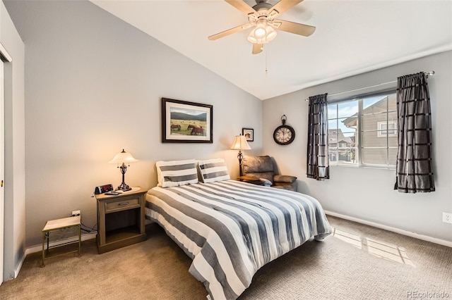 bedroom with a ceiling fan, baseboards, light colored carpet, and lofted ceiling