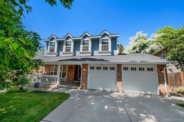 7773 Gunsight Pass, Littleton, CO 80127 - traditional home featuring a porch, driveway, brick siding, and a shingled roof