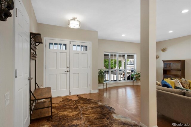 7773 Gunsight Pass, Littleton, CO 80127 - entrance foyer featuring wood finished floors, recessed lighting, and baseboards
