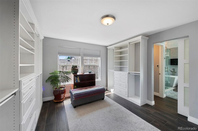 7773 Gunsight Pass, Littleton, CO 80127 - sitting room featuring dark wood-style floors and baseboards