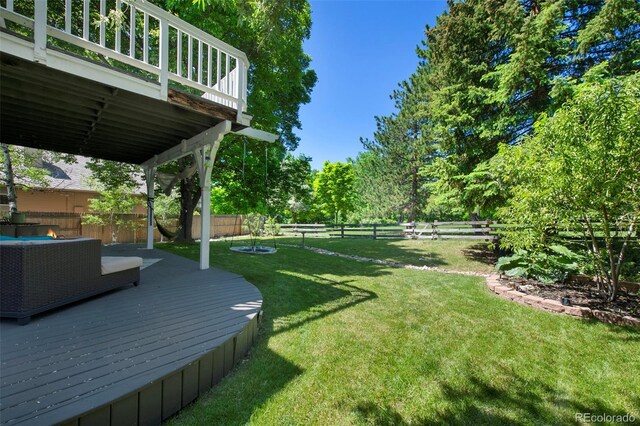 7773 Gunsight Pass, Littleton, CO 80127 - view of yard with a wooden deck