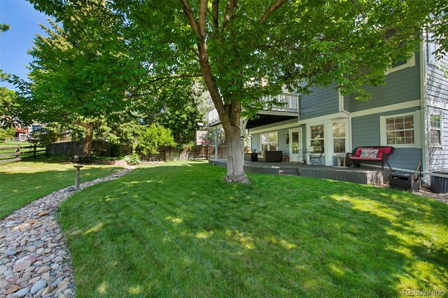 7773 Gunsight Pass, Littleton, CO 80127 - view of yard with a patio and a balcony