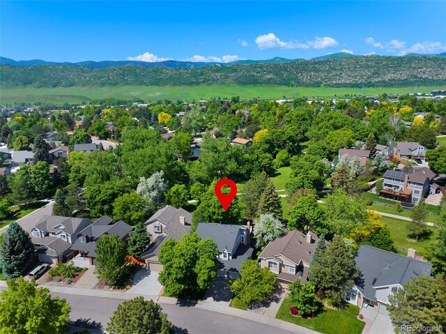 7773 Gunsight Pass, Littleton, CO 80127 - aerial perspective of suburban area with a mountain backdrop