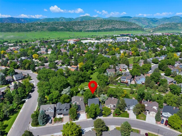 7773 Gunsight Pass, Littleton, CO 80127 - aerial view of residential area featuring a mountain backdrop