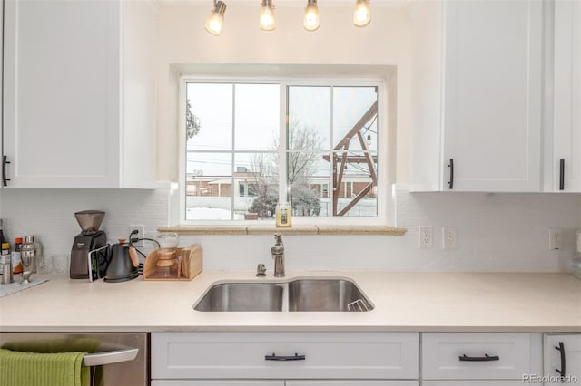 3865 Independence Ct, Wheat Ridge, CO 80033 - kitchen featuring a sink, white cabinetry, and dishwasher