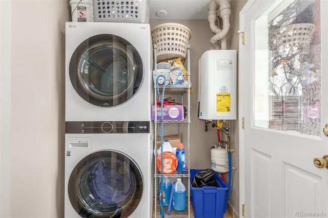 3865 Independence Ct, Wheat Ridge, CO 80033 - laundry area featuring laundry area, stacked washing maching and dryer, and water heater