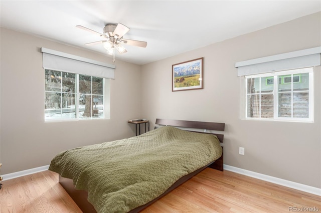 3865 Independence Ct, Wheat Ridge, CO 80033 - bedroom featuring baseboards, ceiling fan, and wood finished floors