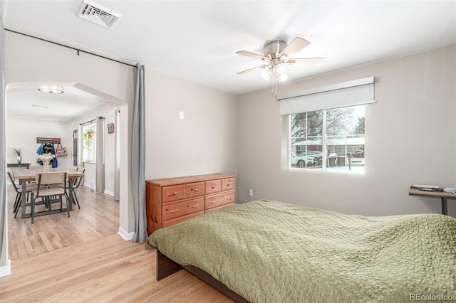 3865 Independence Ct, Wheat Ridge, CO 80033 - bedroom with baseboards, a ceiling fan, light wood-type flooring, and visible vents