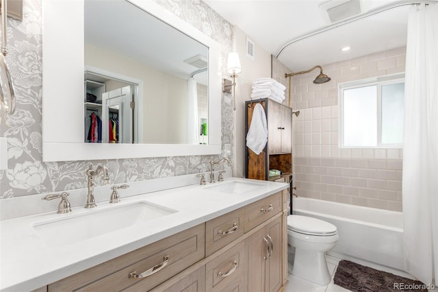 3865 Independence Ct, Wheat Ridge, CO 80033 - full bathroom with a sink, double vanity, toilet, and shower / tub combination