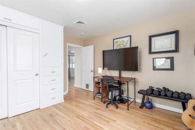 3865 Independence Ct, Wheat Ridge, CO 80033 - home office with visible vents, baseboards, and light wood-style floors