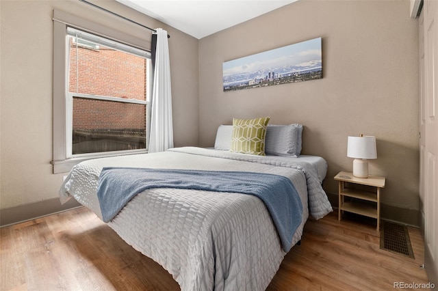 bedroom featuring wood-type flooring