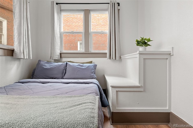 bedroom with wood-type flooring