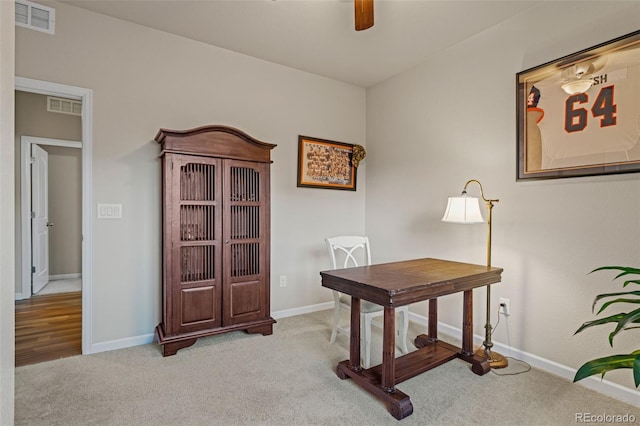 office area with light carpet, baseboards, and visible vents