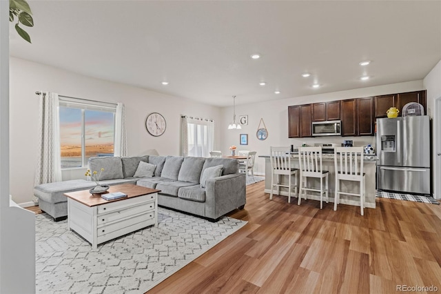 living room featuring light wood-style floors and recessed lighting