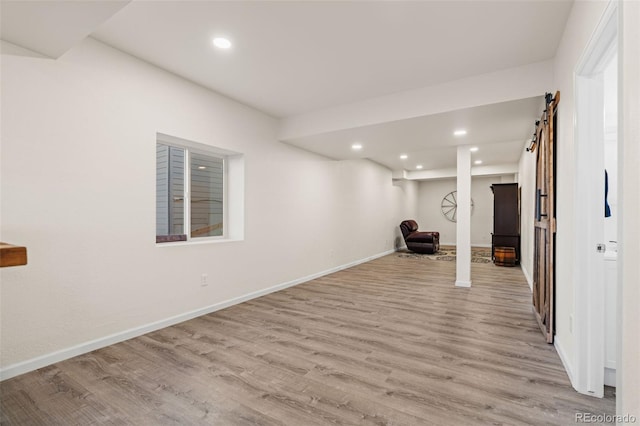 interior space featuring light wood-type flooring, baseboards, and recessed lighting