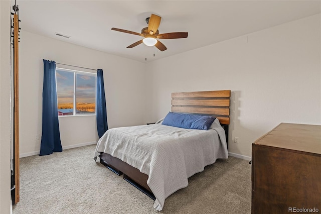 bedroom with a ceiling fan, baseboards, visible vents, and carpet flooring