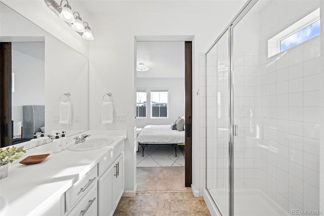 bathroom featuring tile patterned flooring, vanity, and an enclosed shower