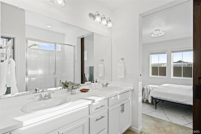 bathroom with vanity, a wealth of natural light, and an enclosed shower