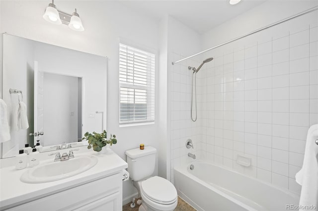 full bathroom featuring vanity, toilet, and tiled shower / bath combo