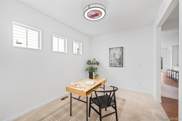 home office with light carpet