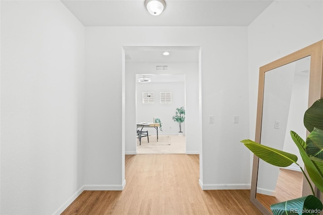 hallway featuring wood-type flooring