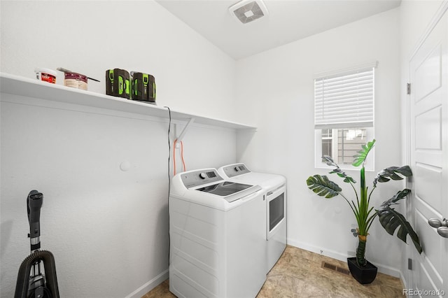 washroom with washer and clothes dryer