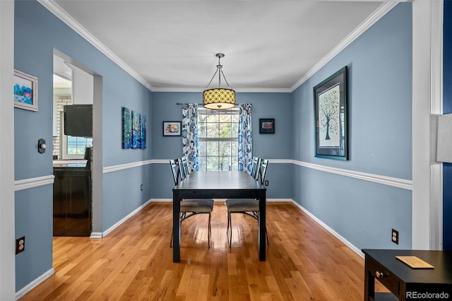 3767 E Phillips Cir, Centennial, CO 80122 - dining room with light wood-type flooring, baseboards, and crown molding