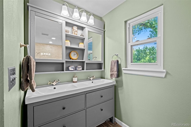 3767 E Phillips Cir, Centennial, CO 80122 - full bathroom featuring double vanity, baseboards, and wood finished floors