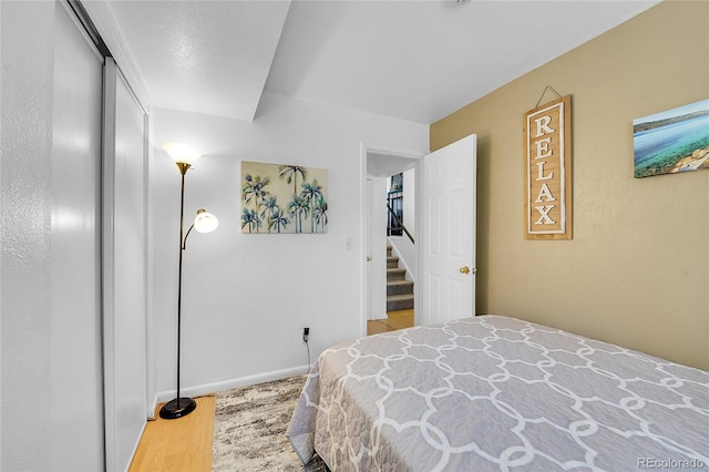 bedroom with wood finished floors