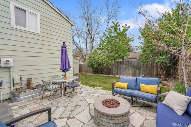 view of patio / terrace with an outdoor living space with a fire pit and outdoor dining space