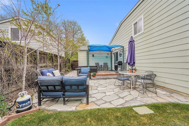 view of patio with a fenced backyard, area for grilling, an outdoor hangout area, and outdoor dining space