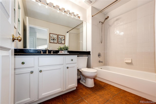 full bathroom featuring visible vents, tile patterned floors, vanity, toilet, and  shower combination