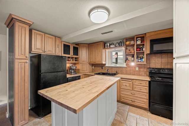 2041 Virginia St, Idaho Springs, CO 80452 - kitchen featuring a sink, butcher block counters, black appliances, visible vents, and backsplash
