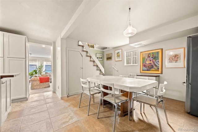 2041 Virginia St, Idaho Springs, CO 80452 - dining space with stairway and visible vents