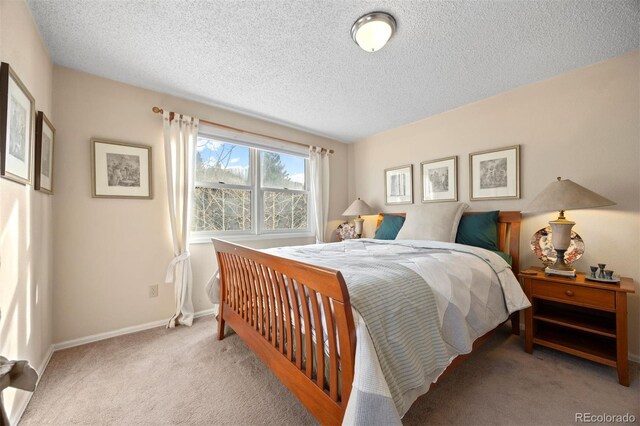 2041 Virginia St, Idaho Springs, CO 80452 - carpeted bedroom with baseboards and a textured ceiling