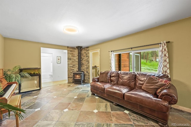 26499 W St, Conifer, CO 80433 - living room with a wood stove and stone finish floors