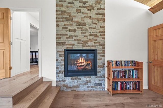 26499 W St, Conifer, CO 80433 - detailed view of wood finished floors and a stone fireplace