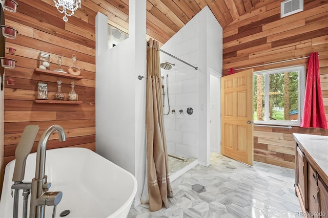 26499 W St, Conifer, CO 80433 - full bath featuring wood walls, vaulted ceiling, a soaking tub, vanity, and a shower stall