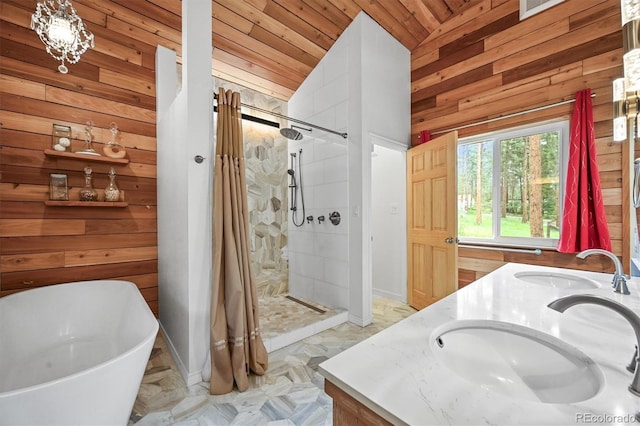 26499 W St, Conifer, CO 80433 - bathroom featuring wooden walls, double vanity, vaulted ceiling, a stall shower, and a freestanding bath