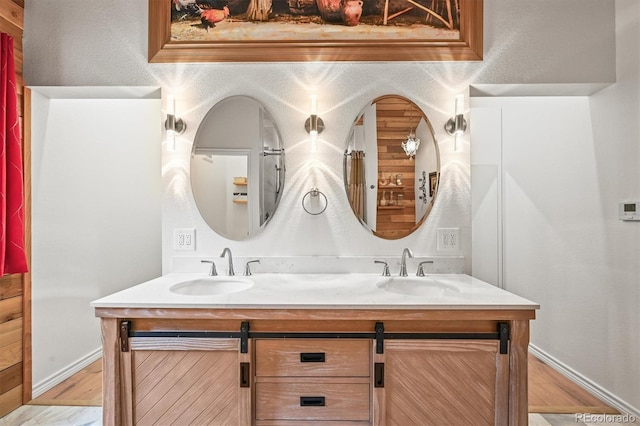 26499 W St, Conifer, CO 80433 - full bath featuring double vanity and wood finished floors