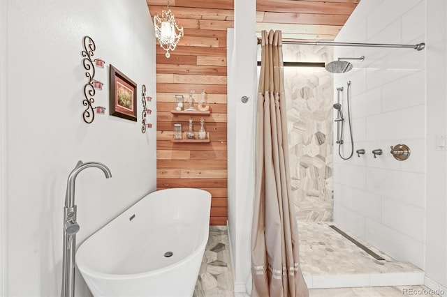 26499 W St, Conifer, CO 80433 - full bathroom featuring wood walls, tiled shower, and a freestanding tub