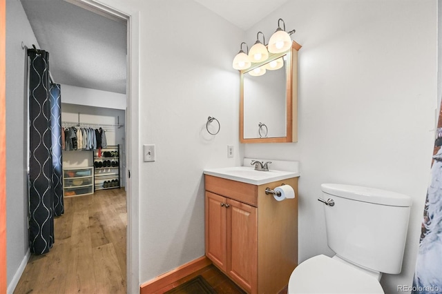 26499 W St, Conifer, CO 80433 - bathroom with vanity and wood finished floors
